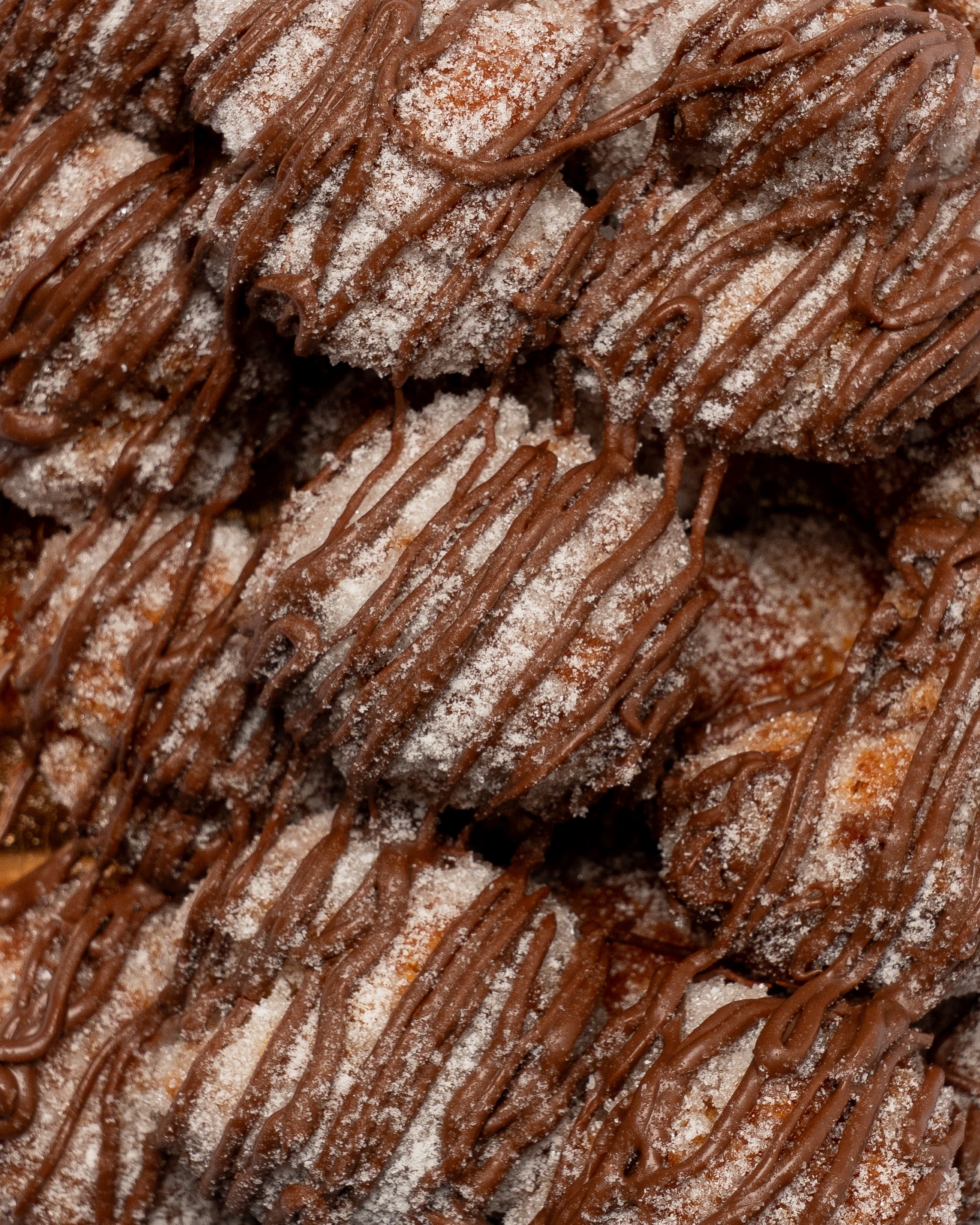 CASTAGNOLE FARCITE AL CIOCCOLATO CON BAGNO ALLA STREGA